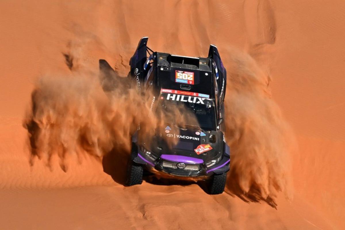 (FILES) Team Overdrive Racing's Argentinian driver Juan Cruz Yacopini and his Spanish co-driver Daniel Oliveras Carreras steer their car during stage 6 of the Dakar rally 2024, a 48h-chrono stage between Shubaytah and Shubaytah, Saudi Arabia, on January 11, 2024. Argentine driver Juan Cruz Yacopini is hospitalized after a serious accident during his vacation in the Argentine province of Mendoza and will not participate in the 2026 Dakar Rally, his team reported on December 21, 2025. PATRICK HERTZOG / AFP