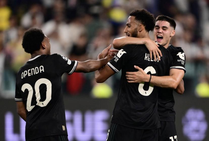 Juventus' English defender #06 Lloyd Kelly (C), Juventus' Turkish forward #10 Kenan Yildiz and Juventus' Belgian defender #20 Ikoma-Lois Openda celebrates at the end of the UEFA Champions League first round day 1 football match between Juventus and Borussia Dortmund at the Allianz stadium in Turin, northern Italy, on September 16, 2025.  Marco BERTORELLO / AFP