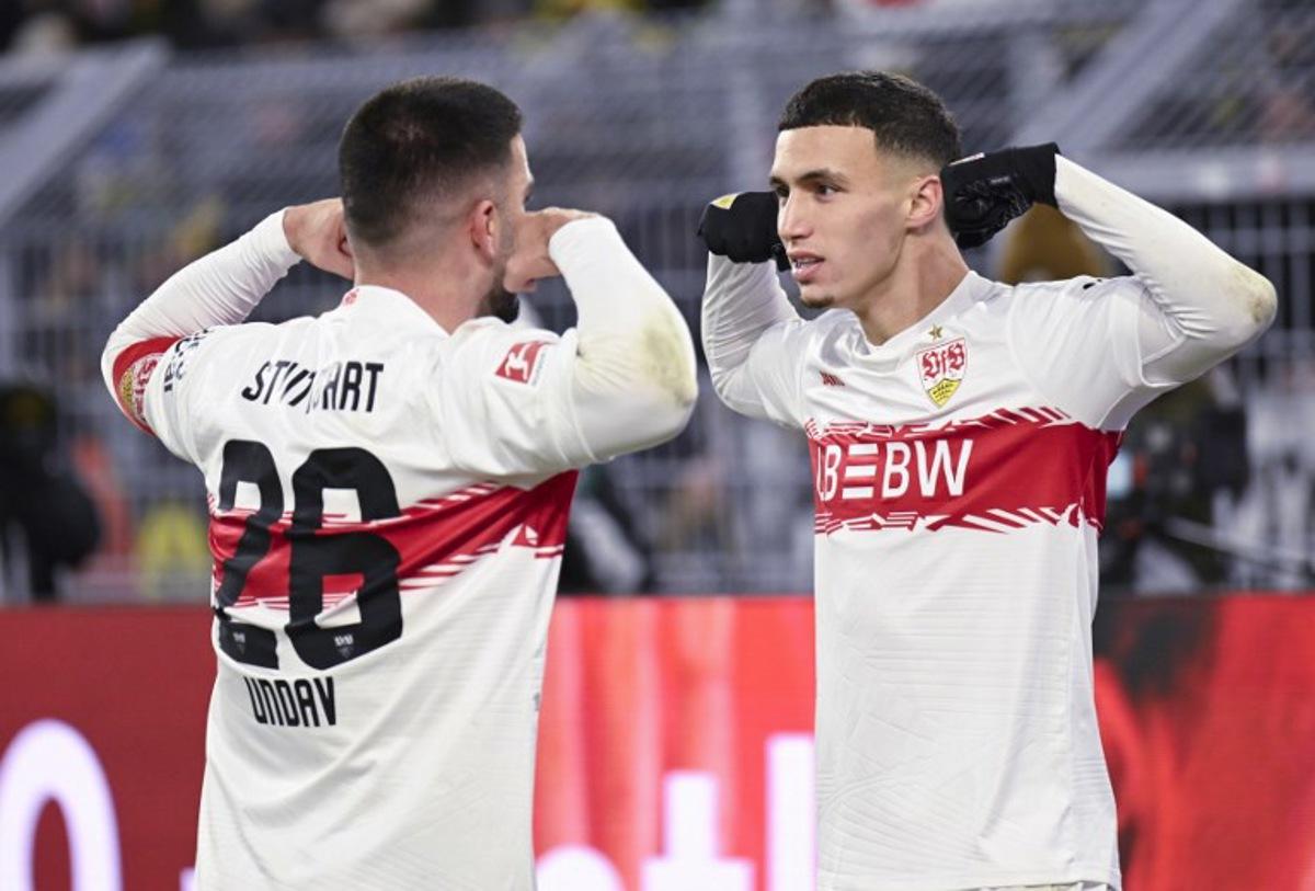 Stuttgart's German forward #26 Deniz Undav (L) celebrates scoring with Stuttgart's German-Marrocan forward #11 Bilal El Khannouss during the German first division Bundesliga football match between Borussia Dortmund and VfB Stuttgart in Dortmund on November 22, 2025.  INA FASSBENDER / AFP