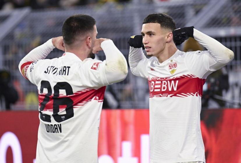 Stuttgart's German forward #26 Deniz Undav (L) celebrates scoring with Stuttgart's German-Marrocan forward #11 Bilal El Khannouss during the German first division Bundesliga football match between Borussia Dortmund and VfB Stuttgart in Dortmund on November 22, 2025.  INA FASSBENDER / AFP
