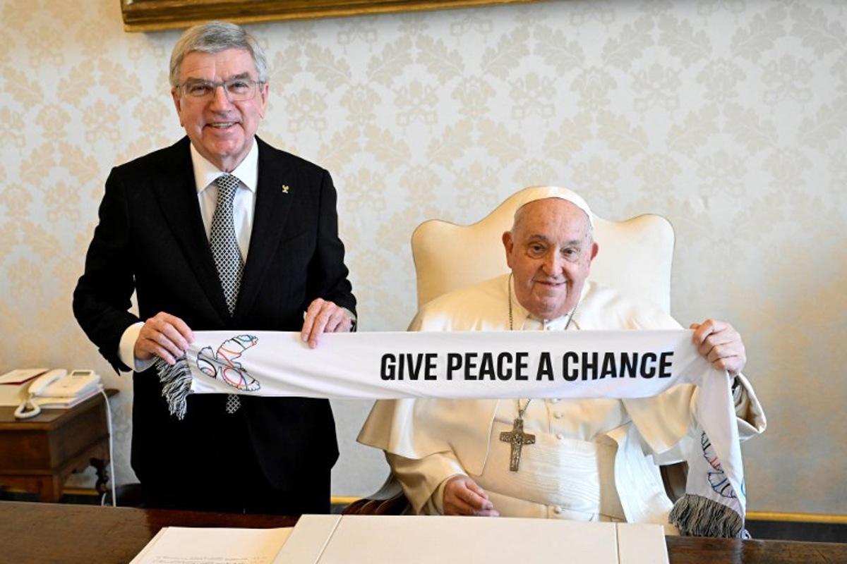 This photo taken and handout on January 23, 2025 by The Vatican Media shows Pope Francis during a private audience with Thomas Bach, the President of the International Olympic Committee (IOC), in The Vatican.  Handout / VATICAN MEDIA / AFP