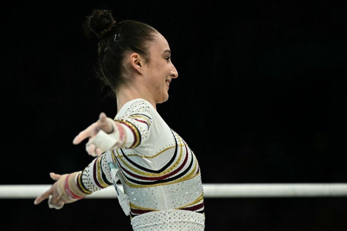Belgium's Nina Derwael reacts after competing in the artistic gymnastics women's uneven bars final during the Paris 2024 Olympic Games at the Bercy Arena in Paris, on August 4, 2024.  Lionel BONAVENTURE / AFP