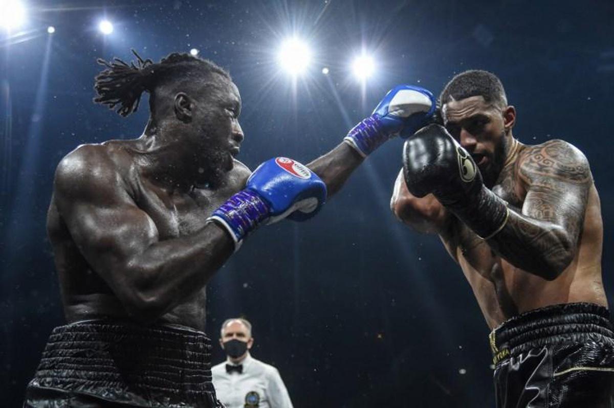 Belgium's Joel Tambwe Djeko (L) throws a jab at France's Tony Yoka during their EBU European Union heavyweight title boxing match at the H Arena in Nantes, western France, on March 5, 2021.   JEAN-FRANCOIS MONIER / AFP