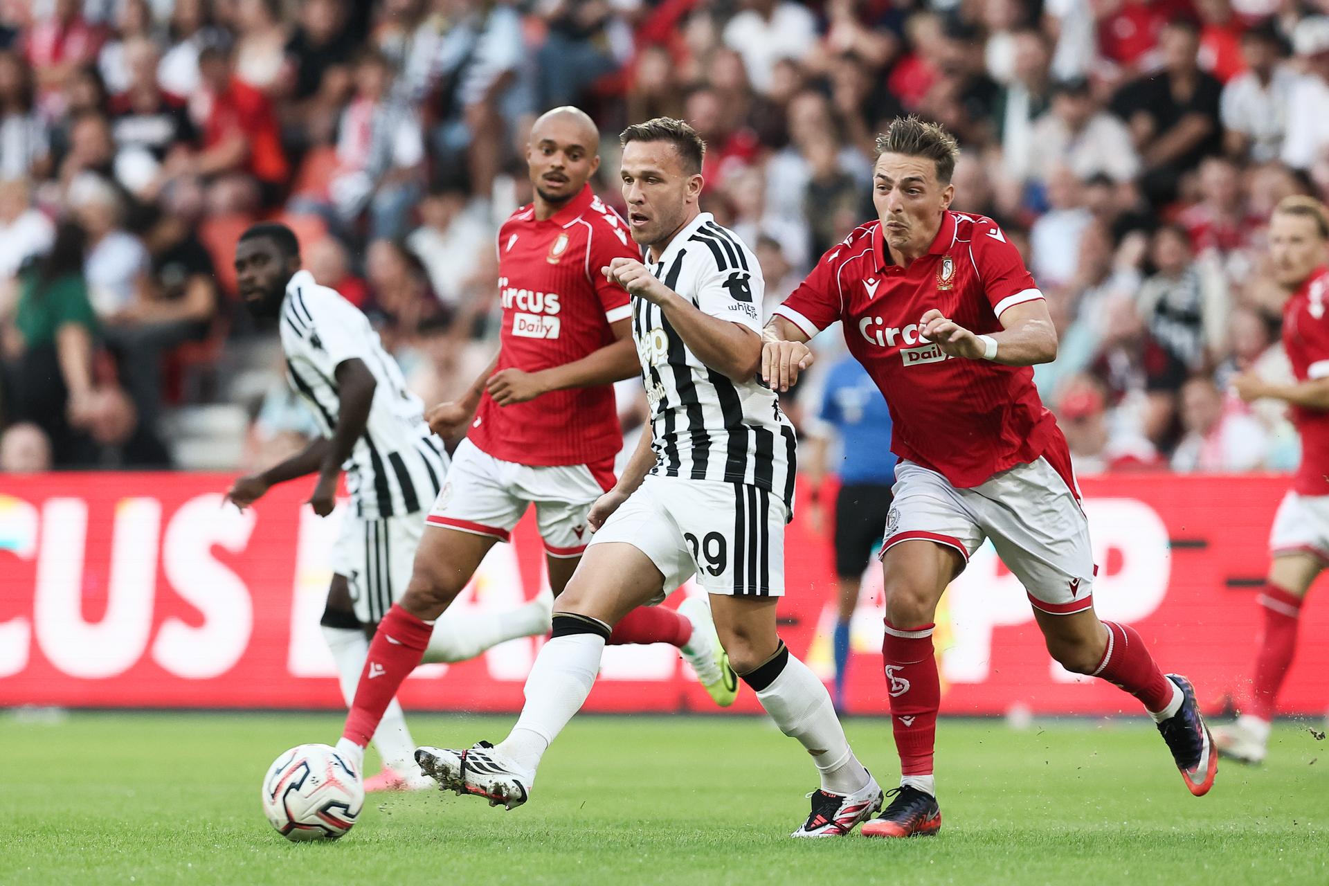 Juventus' Arthur Melo and Standard's Casper Nielsen fight for the ball during a friendly soccer game between Belgian first division soccer team Standard de Liege and Italian Juventus, on Saturday 25 July 2026 in Liege, in preparation of the upcoming 2026-2027 Belgian first division soccer season. BELGA PHOTO BRUNO FAHY