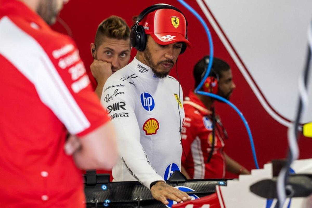 Ferrari's British driver Lewis Hamilton inspects his car during the first practice session at the Hungaroring racetrack in Mogyorod near Budapest, Hungary, on July 24, 2026 ahead of the Formula One Hungarian Grand Prix.  Andrej ISAKOVIC / AFP