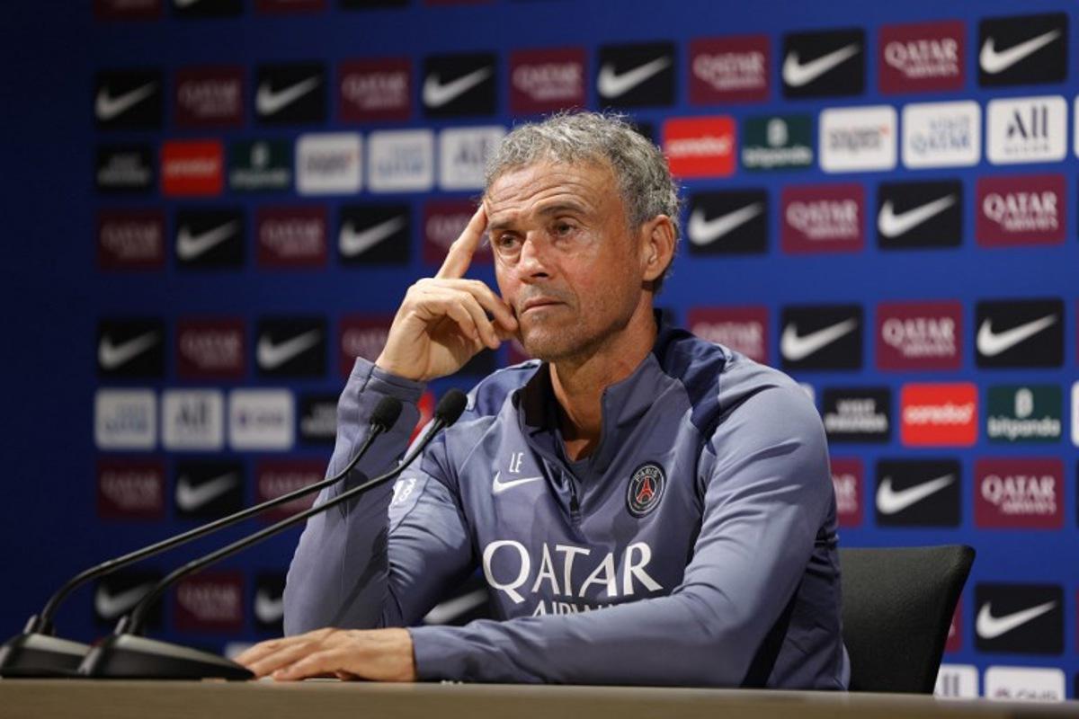 Paris Saint-Germain's Spanish headcoach Luis Enrique holds a press conference at the club's training camp in Poissy, west of Paris, on August 29, 2025.  GEOFFROY VAN DER HASSELT / AFP