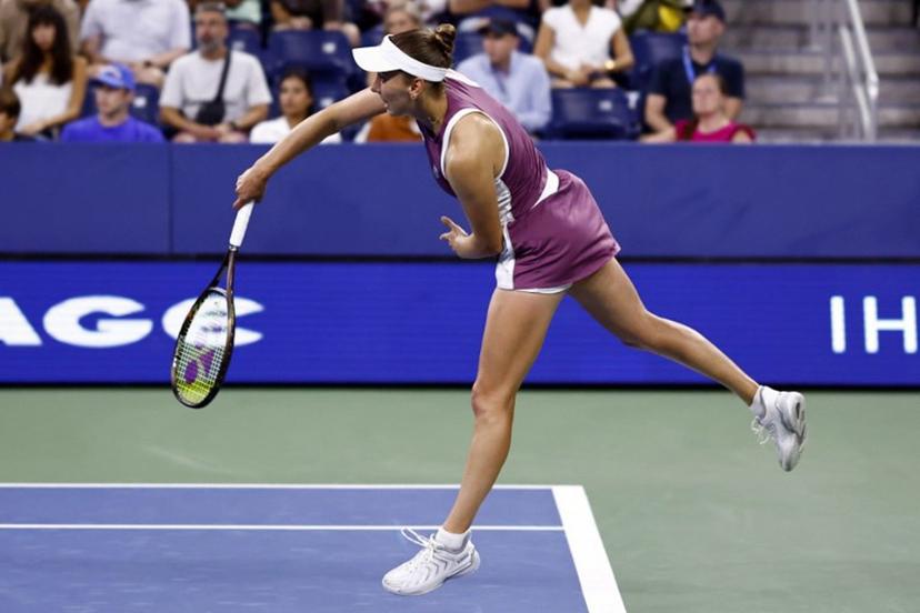 Belgium's Elise Mertens serves to Japan's Naomi Osaka in their women's singles third round tennis match on day seven of the US Open tennis tournament at the USTA Billie Jean King National Tennis Center in New York City on September 5, 2026.  kena betancur / AFP