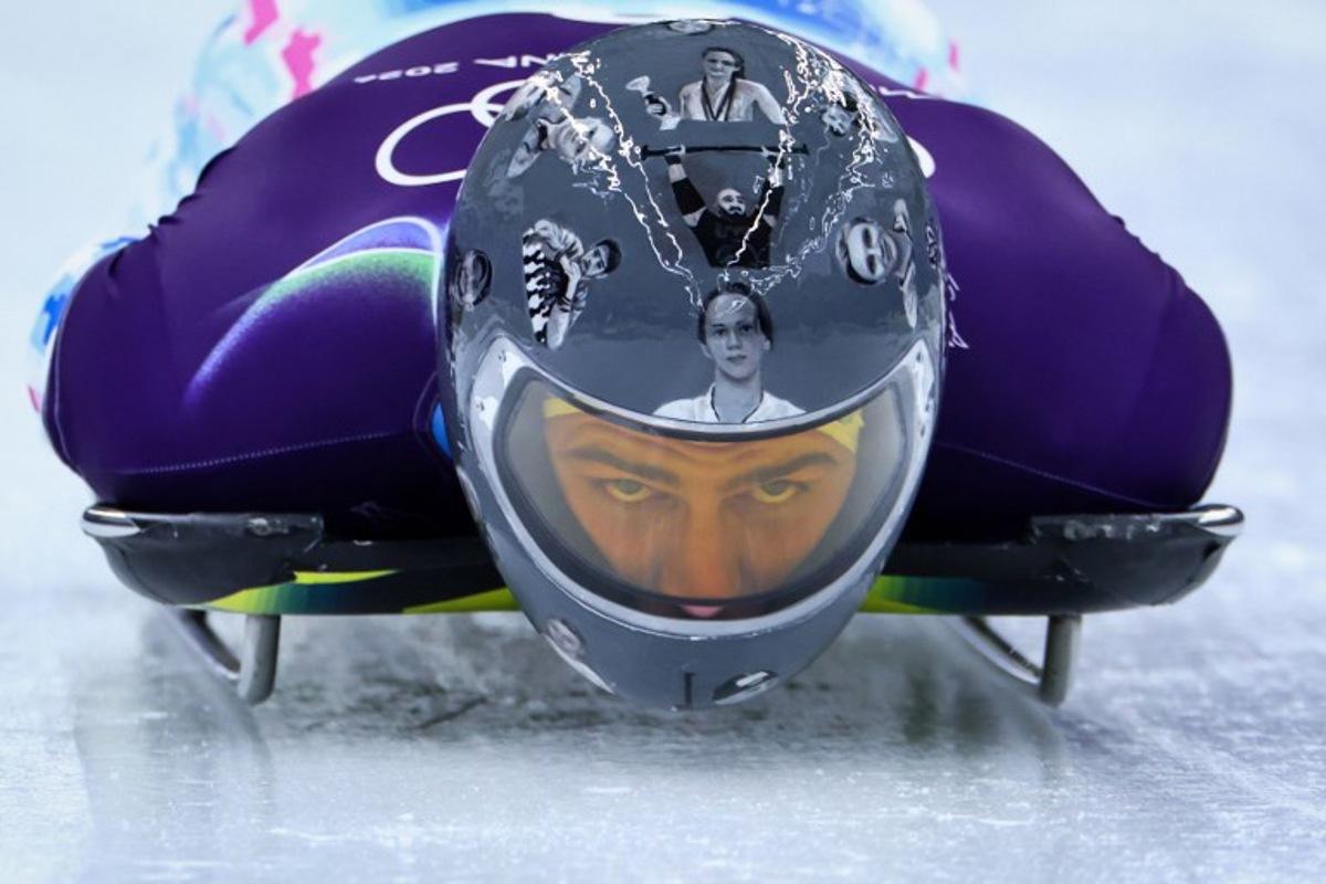 Ukraine's Vladyslav Heraskevych takes part in the skeleton men's training session at Cortina Sliding Centre during the Milano Cortina 2026 Winter Olympic Games in Cortina d'Ampezzo on February 9, 2026.  FRANCK FIFE / AFP