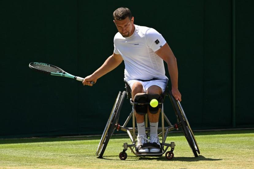 Belgium's Joachim Gerard returns the ball to Japan's Shingo Kunieda during their men's weelchair singles semi final tennis match on the twelfth day of the 2022 Wimbledon Championships at The All England Tennis Club in Wimbledon, southwest London, on July 8, 2022.   SEBASTIEN BOZON / AFP