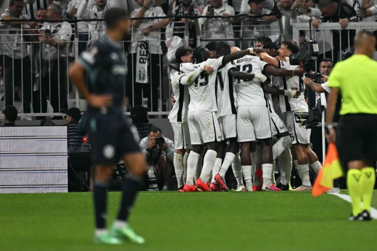 Besiktas' players celebrate their team's first goal during the UEFA Europa League first round 1 day 1 football match between Besiktas and Olympique de Marseille (OM) at Besiktas Tupras Stadium in Istanbul, on September 17, 2026.  Ozan KOSE / AFP