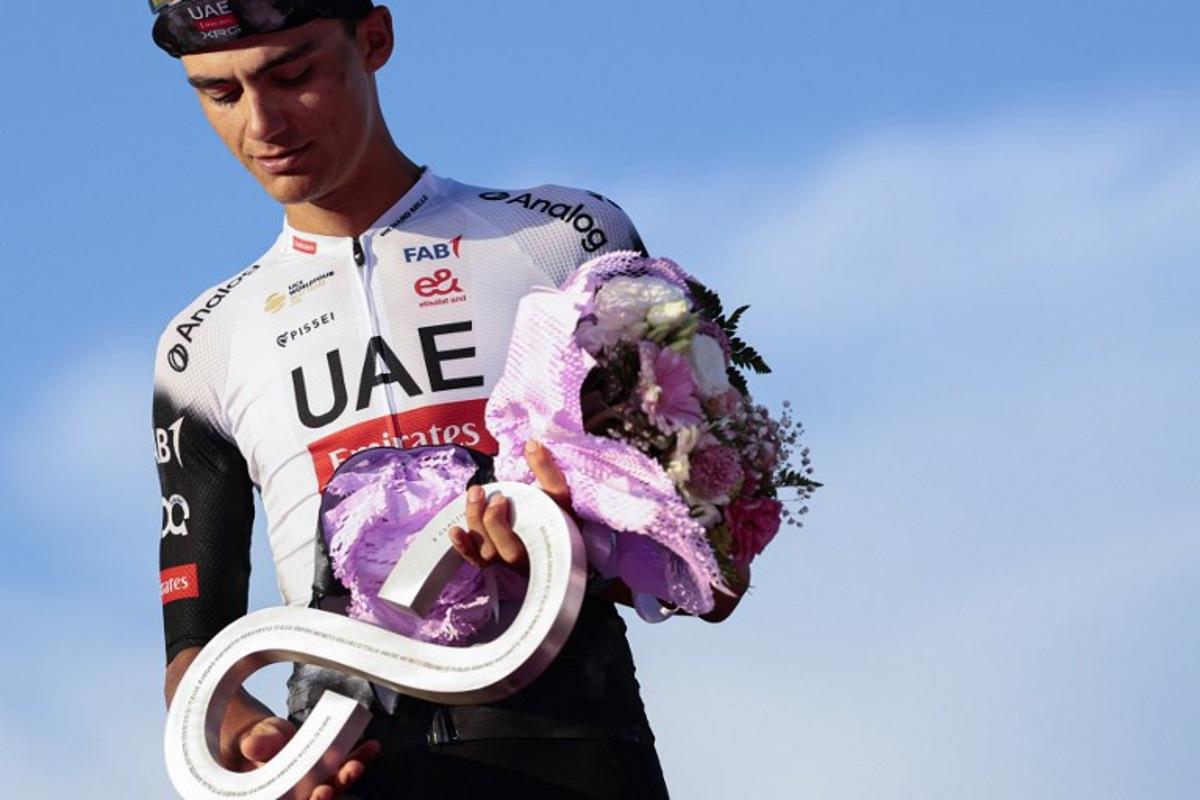 Second placed UAE Team Emirates XRG's Mexican rider Isaac Del Toro celebrates on the podium at the end of the 21st and last stage of the 108th Giro d'Italia cycling race of 143kms from Rome to Rome on June 1, 2025.  Luca Bettini / AFP