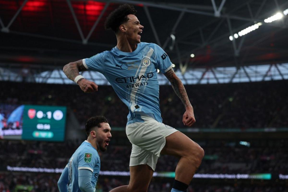 Manchester City's English midfielder #33 Nico O'Reilly celebrates scoring their second goal during the English League Cup final football match between Arsenal and Manchester City at Wembley Stadium in London on March 22, 2026.  Adrian Dennis / AFP