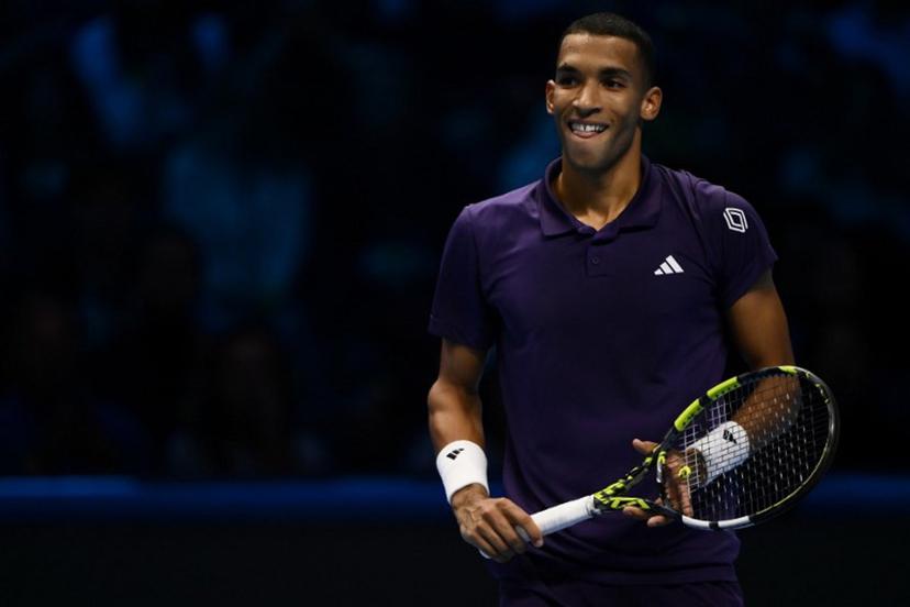 Canada's Felix Auger Aliassime reacts as he plays against Germany's Alexander Zverev during their men's single tennis match at the ATP Finals tennis tournament, in Turin, on November 14, 2025.  MARCO BERTORELLO / AFP