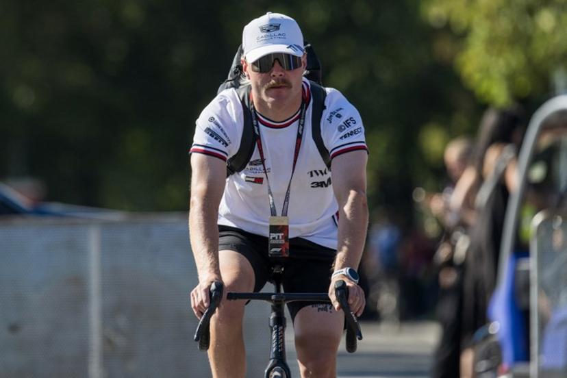 Cadillac's Finnish driver Valtteri Bottas arrives in the paddock with a bicycle ahead of the Italian Formula One Grand Prix at the Autodromo Nazionale Monza circuit in Monza, northern Italy on September 4, 2026.  Andrej ISAKOVIC / AFP