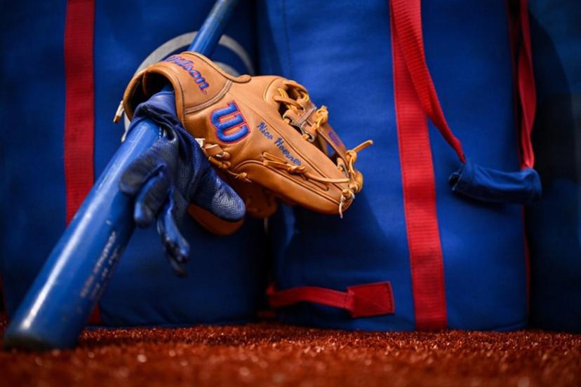 The glove and bat of Chicago Cubs' Nico Hoerner  are pictured prior to the first of the two-game, 2023 major league baseball London Series between the St. Louis Cardinals and the Chicago Cubs at London Stadium in east London on June 24, 2023.  Ben Stansall / AFP
