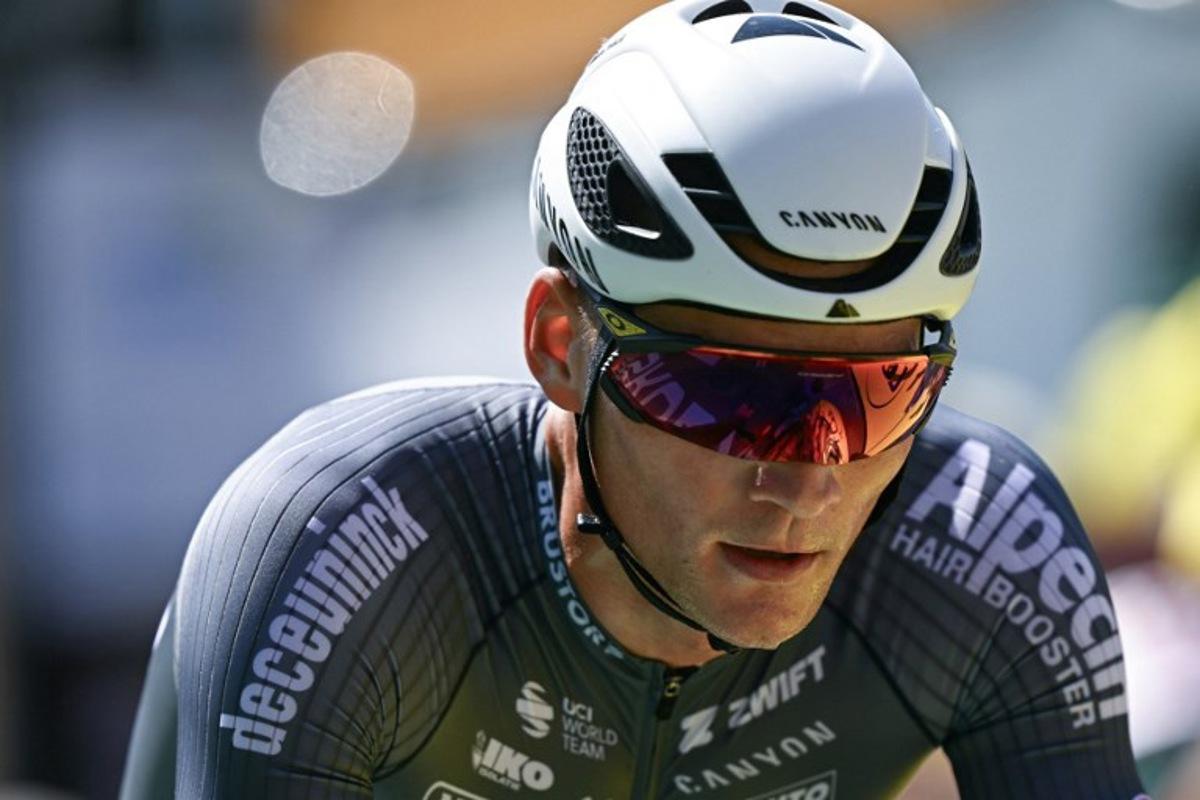 Alpecin - Deceuninck team's Dutch rider Mathieu van der Poel cycles to the finish line of the 13th stage of the 112th edition of the Tour de France cycling race, 10.9 km individual time trial between Loudenvielle and Peyragudes, in the Pyrenees mountains of southwestern France, on July 18, 2025.  Loic VENANCE / AFP