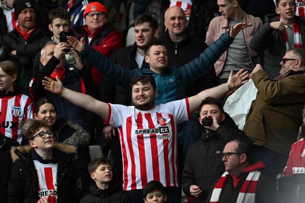 Sunderland fans build the atmosphere in the crowd ahead of the English FA Cup third round football match between Sunderland and Newcastle United at The Stadium of Light in Sunderland in north east England on January 6, 2024.  Paul ELLIS / AFP