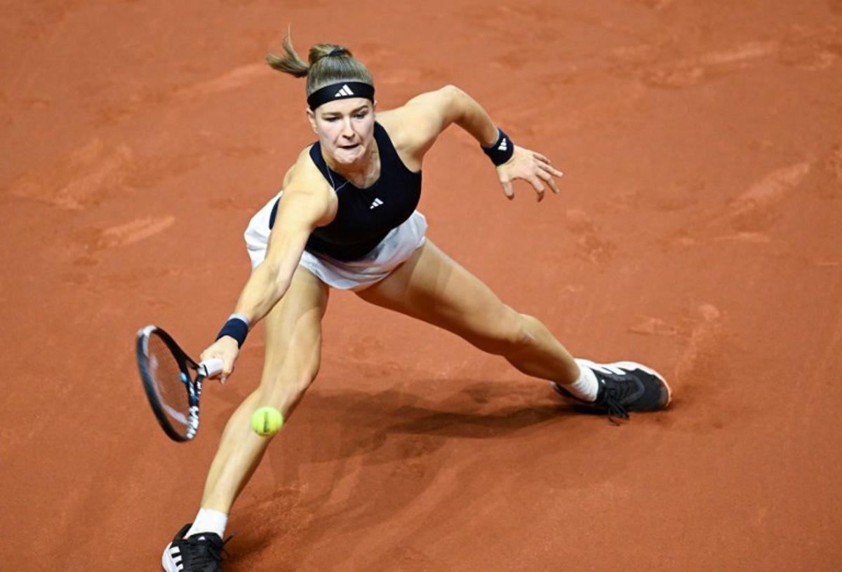Czech Republic's Karolina Muchova returns the ball to Ukraine's Elina Svitolina (unseen) during their semi-final match of the 2026 WTA Stuttgart Open Tennis Tournament on April 18, 2026 in Stuttgart, south-western Germany.  THOMAS KIENZLE / AFP