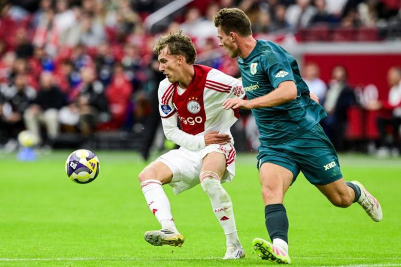 Ajax's Belgian forward #11 Mika Godts (L) fights for the ball with PEC Zwolle's Dutch defender #03 Olivier Aertssen during the Dutch Eredivisie football match between Ajax Amsterdam and and PEC Zwolle at the Johan Cruijff ArenA in Amsterdam on September 13, 2025.  Olaf Kraak / ANP / AFP