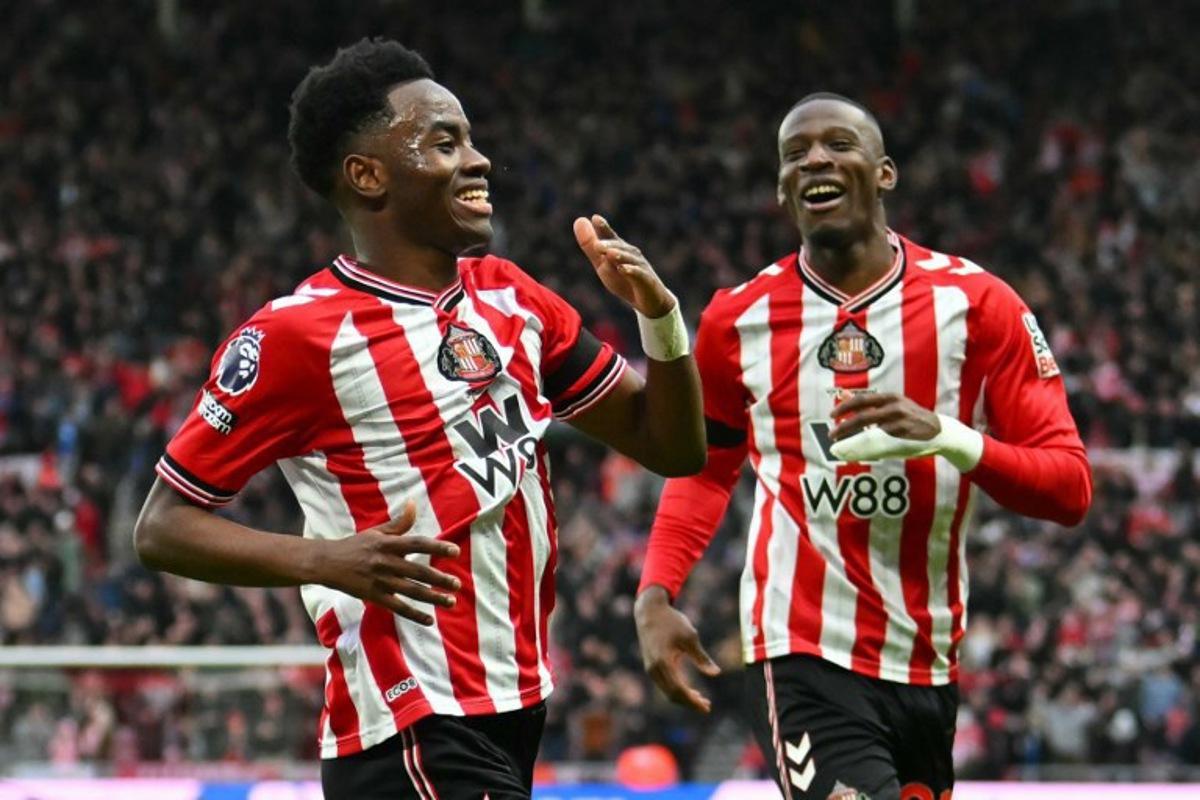 Sunderland's English Ivorian #24 Simon Adingra (L) celebrates after scoring the opening goal of the English Premier League football match between Sunderland and Leeds United at The Stadium of Light in Sunderland in north east England on December 28, 2025.  ANDY BUCHANAN / AFP