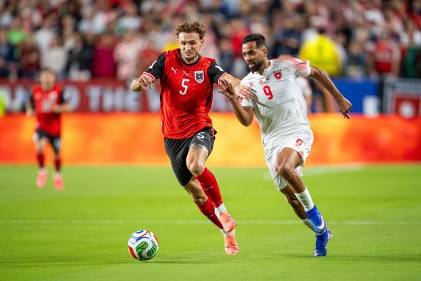 Austria's defender #05 Stefan Posch and Jordan's forward #09 Ali Olwan fight for the ball during the 2026 World Cup Group J football match between Austria and Jordan at the San Francisco Bay Area Stadium in Santa Clara, on June 16, 2026.   GEORG HOCHMUTH / APA / AFP