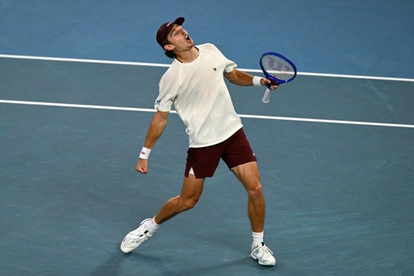 Australia's Alex De Minaur celebrates beating Kazakhstan's Alexander Bublik in their men's singles match on day eight of the Australian Open tennis tournament in Melbourne on January 25, 2026.  WILLIAM WEST / AFP