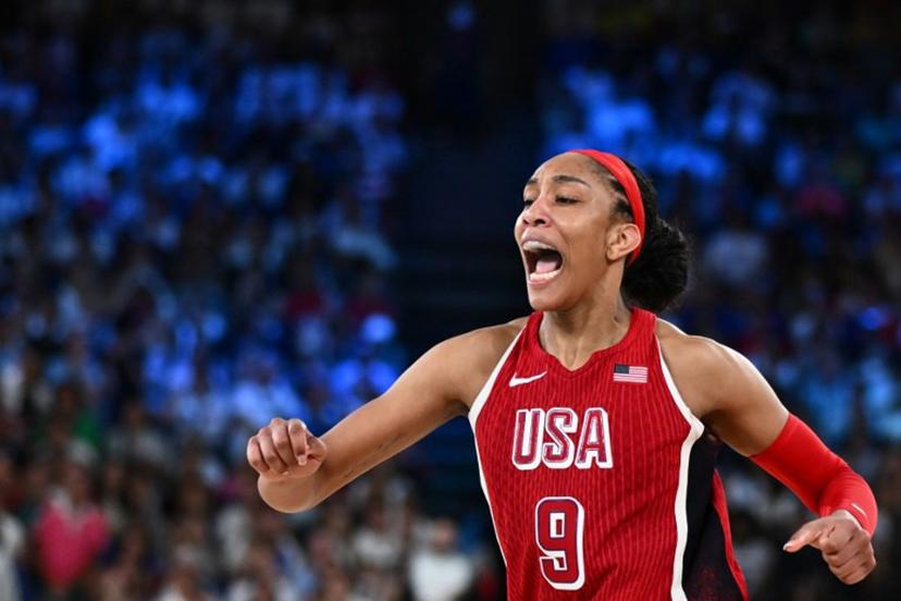 USA's #09 A'ja Wilson celebrates after scoring in the women's Gold Medal basketball match between France and the USA during the Paris 2024 Olympic Games at the Bercy  Arena in Paris on August 11, 2024.  Aris MESSINIS / AFP