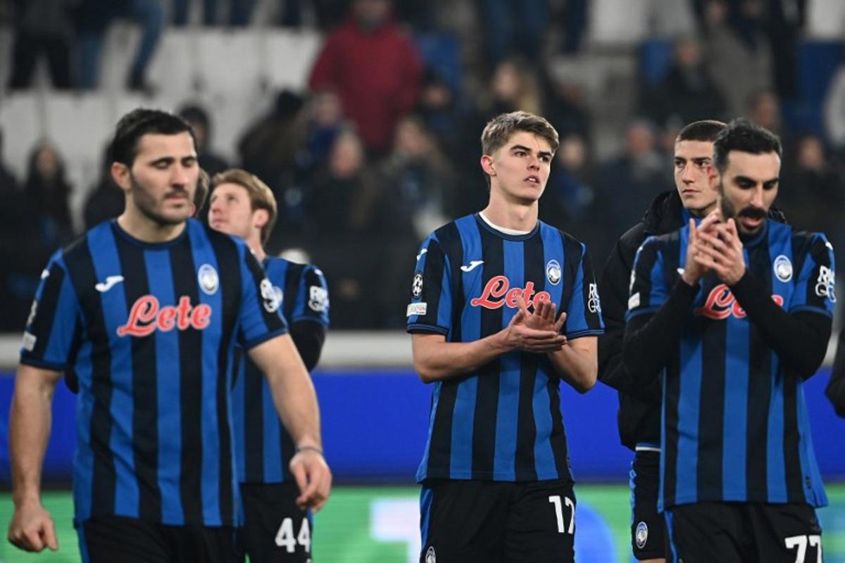Atalanta's Belgian midfielder #17 Charles De Ketelaere (C) reacts at the end of the UEFA Champions League knockout phase play-off 2nd leg football match between Club Brugge KV and Atalanta at the Stadio di Bergamo in Bergamo on February 18, 2025.  Isabella BONOTTO / AFP
