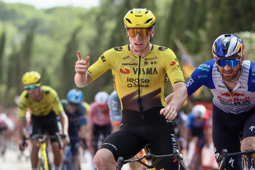 Team Visma-Lease a bike's British rider Matthew Brennan celebrates as he crosses the finish line to win the fifth stage of the Vuelta a Espana 2026, a 173,4 km race between Falset and Roquetes on August 26, 2026.    Josep LAGO / AFP