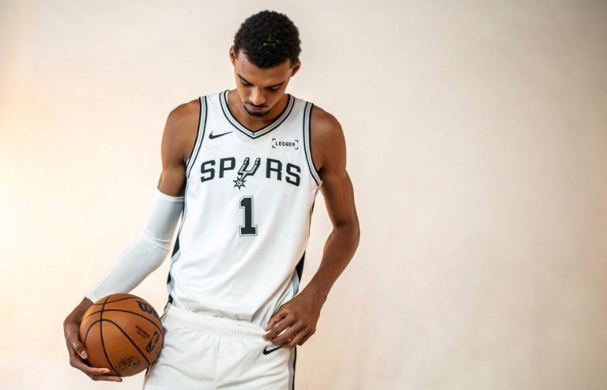 French basketball player Victor Wembanyama poses for promotional photos during the San Antonio Spurs media day at the Victory Capital Performance Center in San Antonio, Texas on September 29, 2025. Wembanyama has been cleared by the team's medical staff to play for the upcoming season. SERGIO FLORES / AFP