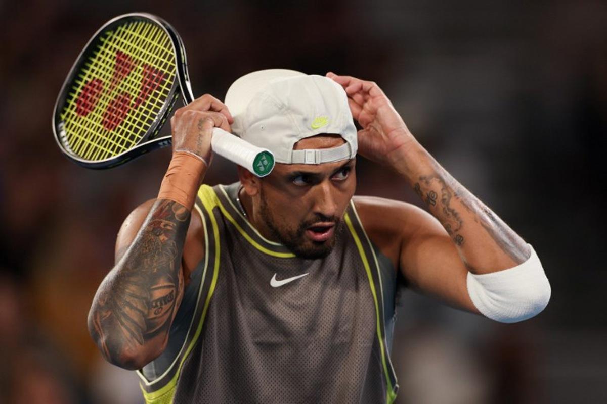 Australia's Nick Kyrgios reacts after a point against Australia's James Duckworth and Aleksandar Vukic during their men's doubles match on day five of the Australian Open tennis tournament in Melbourne on January 16, 2025.  Adrian DENNIS / AFP
