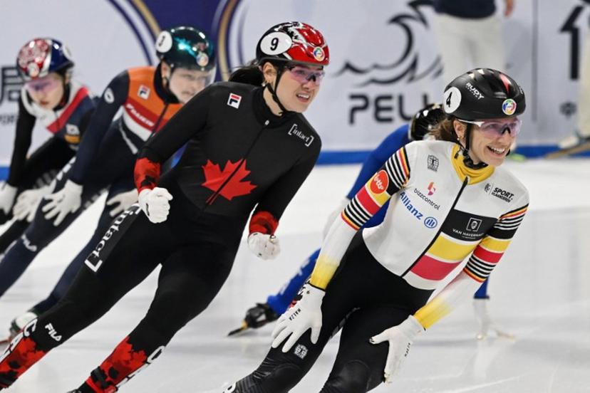 Belgium's Hanne Desmet (R) celebrates after winning the women's 1000 meters final at the ISU World Short Track Championships in Beijing on March 15, 2025.  GREG BAKER / AFP