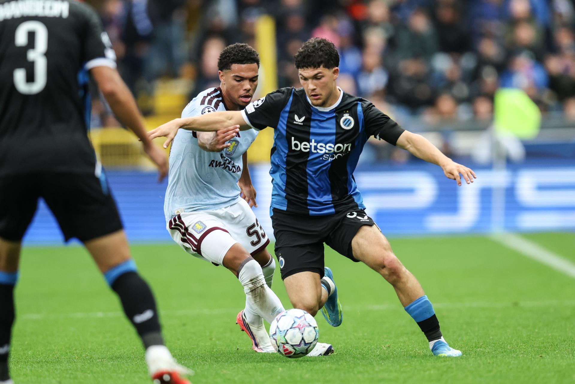 Aston Villa's George Hemmings and Club's Kyriani Sabbe fight for the ball during a soccer game between Belgian soccer team Club Brugge KV and English Aston Villa FC, on Tuesday 8 September 2026 in Brugge, on the first game of the UEFA Champions League league phase. BELGA PHOTO BRUNO FAHY
