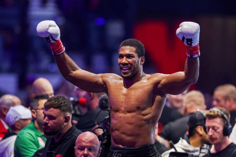 Britain's boxer Anthony Joshua celebrates winning against Albania's boxer Kristian Prenga in their heavyweight boxing fight at the Jeddah Superdome in Jeddah on July 26, 2026. Two-time heavyweight world champion Anthony Joshua survived two early knockdowns on the way to a second-round knockout of Kristian Prenga on July 26, his triumphant ring return paving the way for a blockbuster all-British bout with Tyson Fury. AFP