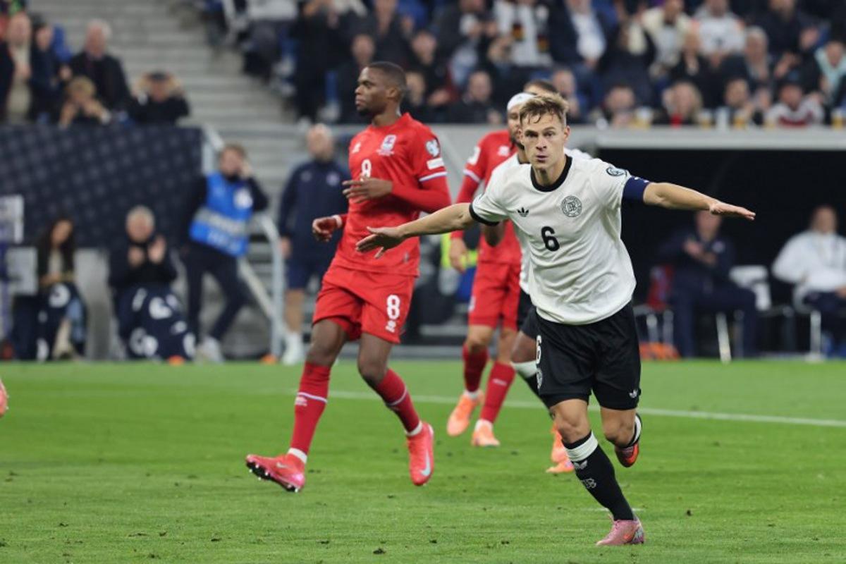 Germany's midfielder #06 Joshua Kimmich celebrates after shooting from the penalty spot to score his team's second goal during the 2026 World Cup qualifiers Europe zone group A football match between Germany and Luxembourg on October 10, 2025 in Sinsheim, western Germany  Daniel ROLAND / AFP