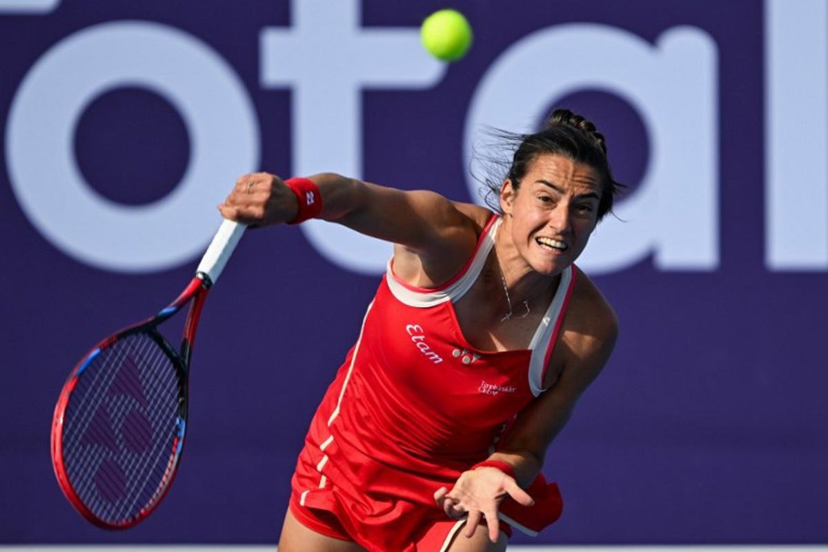 Caroline Garcia of France returns the ball to Jasmine Paolini of Italy during their 2025 WTA Qatar Open match at the Khalifa International Tennis Complex in Doha on February 11, 2025.  Mahmud HAMS / AFP