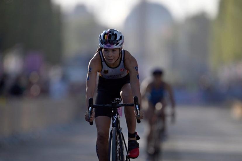 Germany's Lisa Tertsch competes in the cycling race, during the mixed's relay triathlon, at the Paris 2024 Olympic Games, in central Paris, on August 5, 2024.  Mauro PIMENTEL / AFP