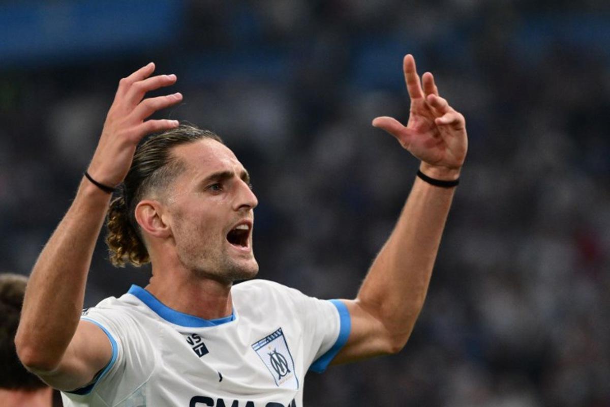 Marseille's French midfielder #25 Adrien Rabiot celebrates after scoring during their ligue 1 football match Olympic of Marseille (OM) against stade Rennais at the Velodrome stadium in Marseille on May 17, 2025.  Christophe SIMON / AFP