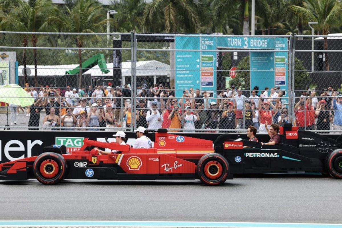 (L-R) Ferrari's Monegasque driver Charles Leclerc, Ferrari's British driver Lewis Hamilton, Mercedes' British driver George Russell and Mercedes' Italian driver Andrea Kimi Antonelli ride in Lego cars during the Driver's Parade before the 2025 Miami Formula One Grand Prix at Miami International Autodrome in Miami Gardens, Florida, on May 4, 2025.   CHARLY TRIBALLEAU / AFP