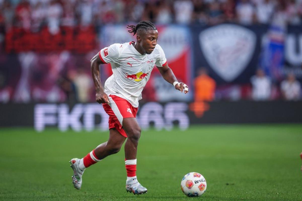 Leipzig's Belgian forward #09 Johan Bakayoko plays the ball during the German first division Bundesliga football match RB Leipzig v FC Cologne v in Leipzig, eastern Germany on September 20, 2025.  Ronny Hartmann / AFP