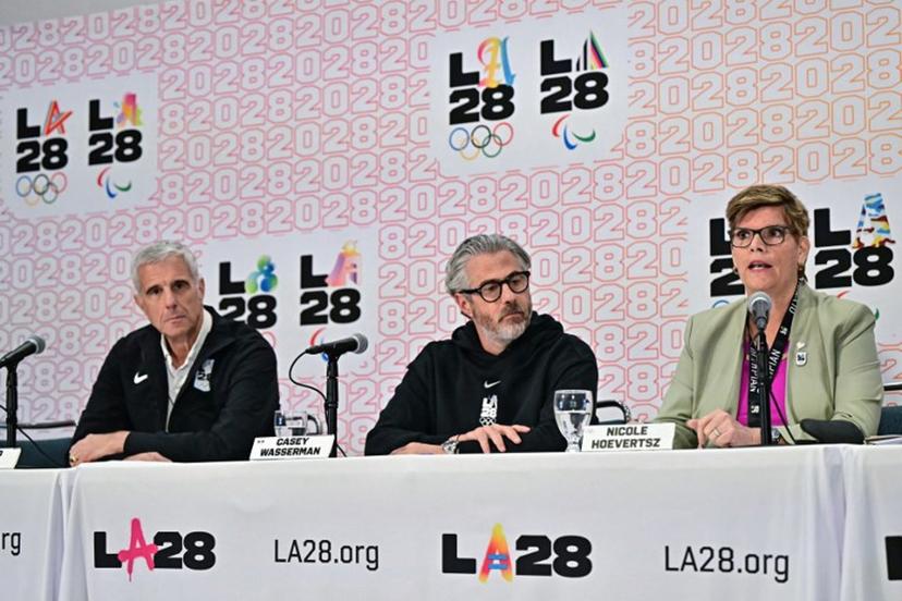 (L/R) LA28 CEO Reynold Hoover, LA28 Chairperson and President Casey Wasserman, and IOC Vice President and LA28 Coordination Commiussion chairperson Nicole Hoevertsz participate in a press conference with the International Olympic Committee (IOC) Coordination Commission for the Los Angeles 2028 Olympic and Paralympic Games, at the LA Convention Center in Los Angeles on June 5, 2025.  Frederic J. Brown / AFP