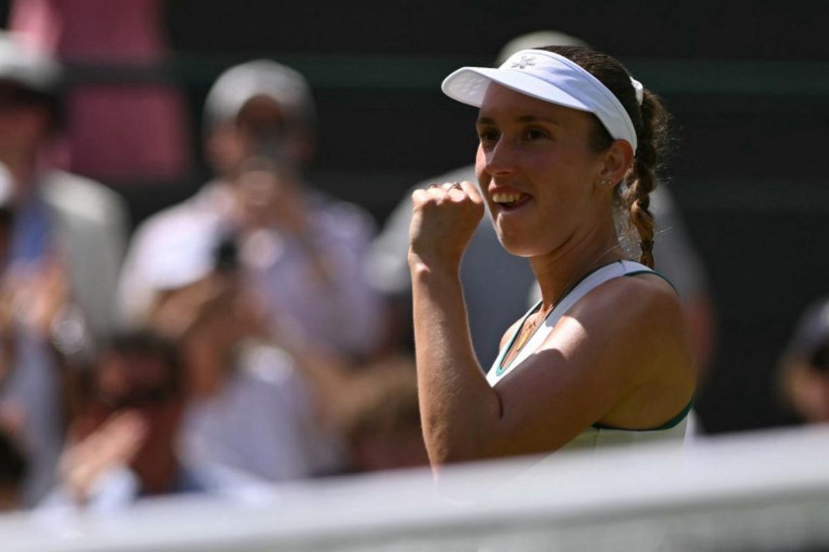 Belgium's Elise Mertens celebrates winning against Kazakhstan's Elena Rybakina during their women's singles third round tennis match on the sixth day of the 2026 Wimbledon Championships at The All England Lawn Tennis and Croquet Club in Wimbledon, southwest London, on July 4, 2026.  Glyn KIRK / AFP