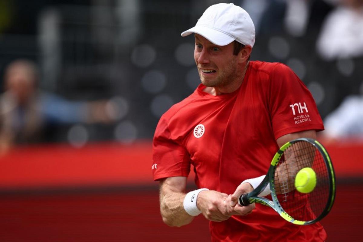 Netherlands' Botic van de Zandschulp returns against US player Tommy Paul during their men's singles round of 16 tennis match on day three of the ATP HSBC Championships at Queen's Club in west London on June 18, 2026.  Henry Nicholls / AFP