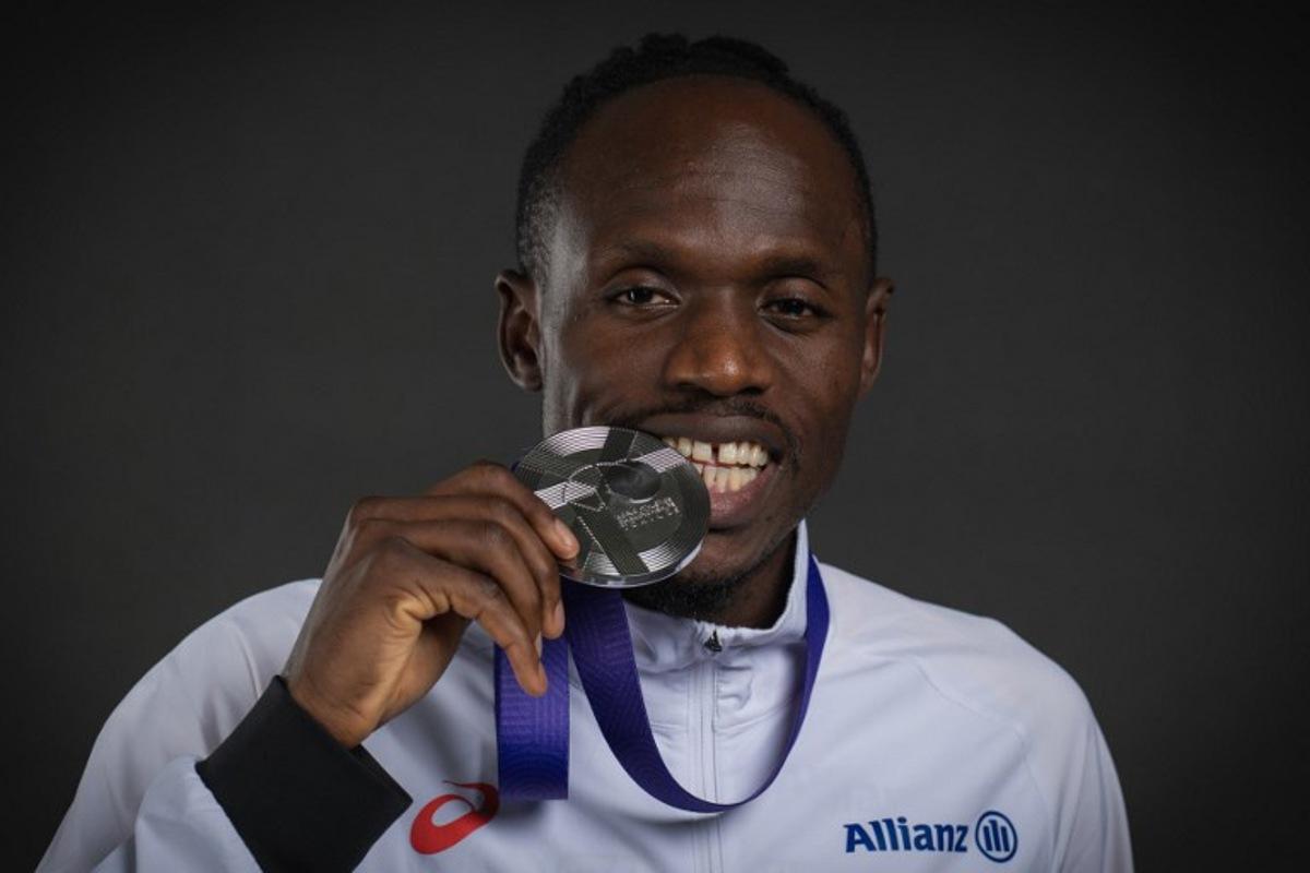 Silver medallist in the men's 5000m event Belgium's athlete Isaac Kimeli poses for portraits during a studio photo session on the sidelines of the World Athletics Championships in Tokyo on September 21, 2025.  Andrej ISAKOVIC / AFP