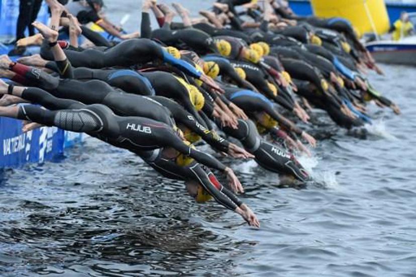This picture shows the start of the swimming discipline at the 2016 ITU World Triathlon in Stockholm on July 2, 2016. 
PONTUS LUNDAHL / TT NEWS AGENCY / AFP Sweden OUT

