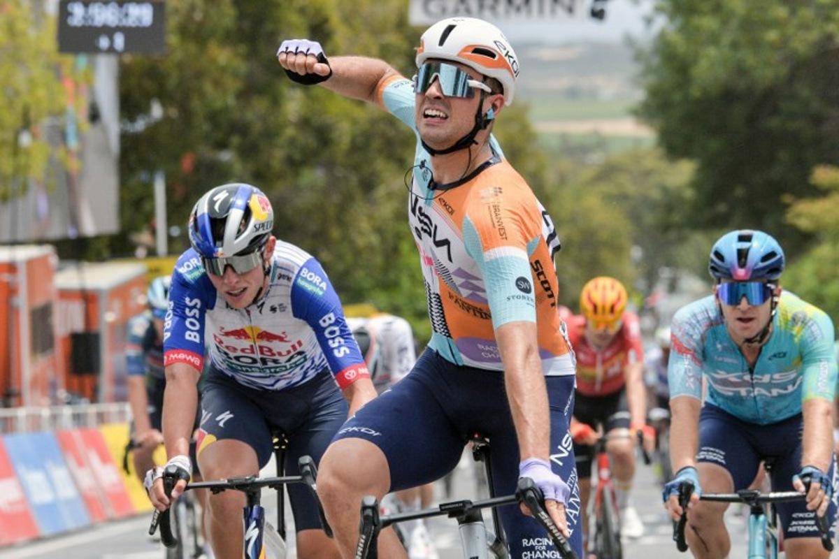 NSN Cycling Team's British rider Ethan Vernon (C) crosses the finish line to win stage four of the Tour Down Under UCI men's cycling race in Adelaide on January 24, 2026.   Brenton Edwards / AFP
