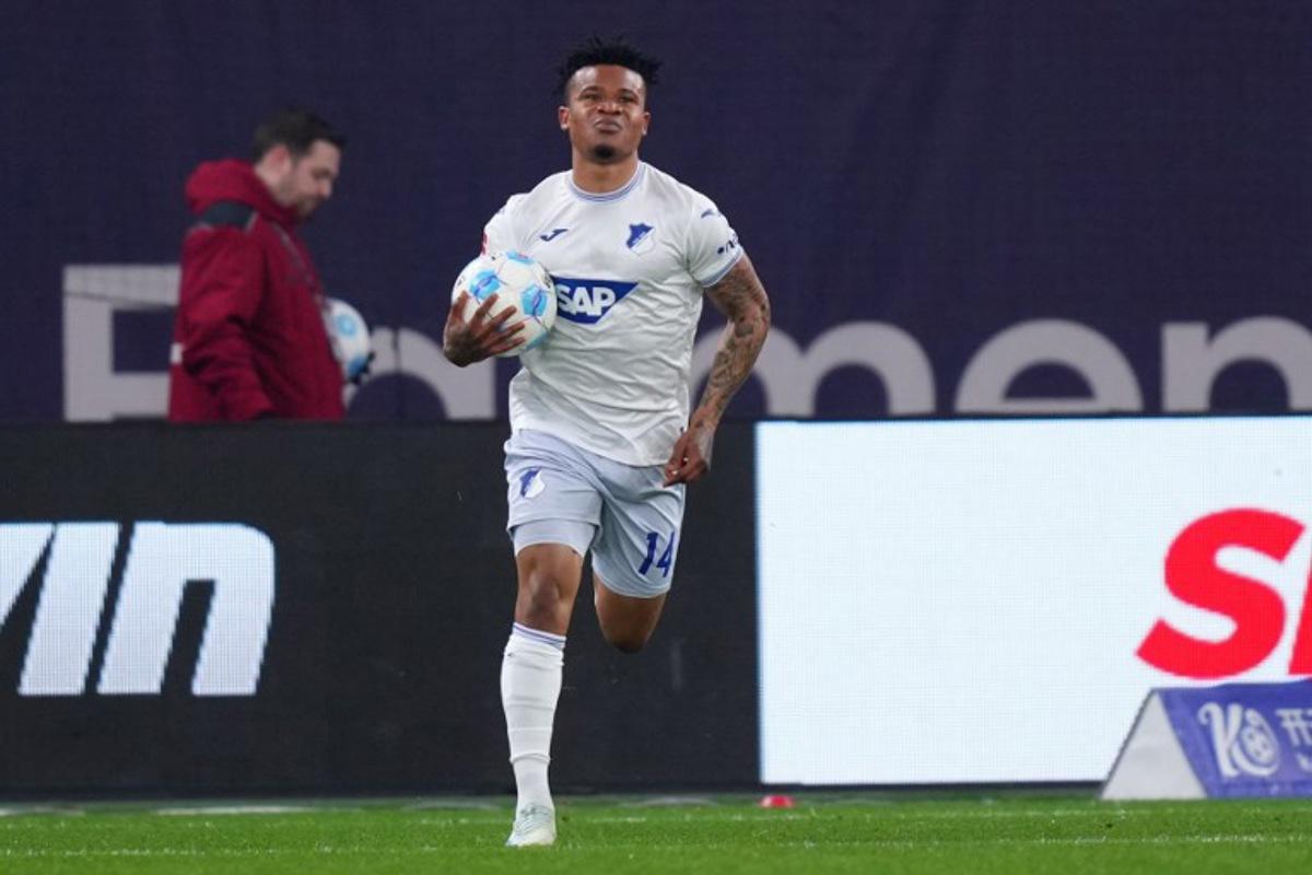 Hoffenheim's Nigerian forward #14 Gift Orban celebrates after scoring the 3-1 goal during the German first division Bundesliga football match Bayer 04 Leverkusen v TSG 1899 Hoffenheim in Leverkusen, western Germany on February 2, 2025.  Pau Barrena / AFP