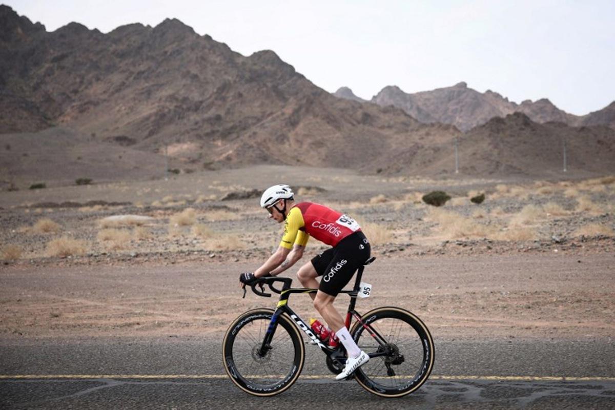 Cofidis cycling team's French Hugo Page rides during the first stage of the AlUla Tour cycling race, a 158 km race started and finished in the Saudi desert city of AlUla, on January 27, 2026.  Anne-Christine POUJOULAT / AFP