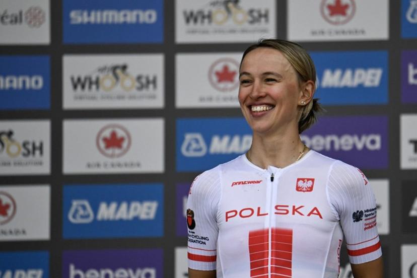 Second-placed Katarzyna Niewiadoma of Poland smiles on the podium after the Women's Elite Road Race at the 2026 Union Cycliste Internationale (UCI) Road World Championships in Montreal, Quebec, on September 26, 2026.  Andrej Ivanov / AFP