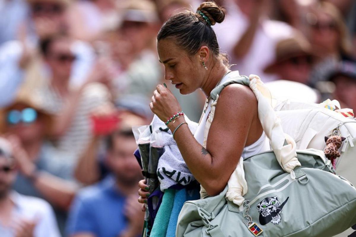 Belarus's Aryna Sabalenka reacts as she leaves Centre Court following her defeat against US player Amanda Anisimova during their women's singles semi-final tennis match on the eleventh day of the 2025 Wimbledon Championships at The All England Lawn Tennis and Croquet Club in Wimbledon, southwest London, on July 10, 2025.  HENRY NICHOLLS / AFP